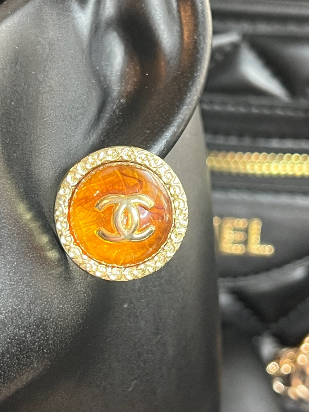 Ear is actual size. Amber Cabochon. Logo Gold-Tone Gold Rim Earrings